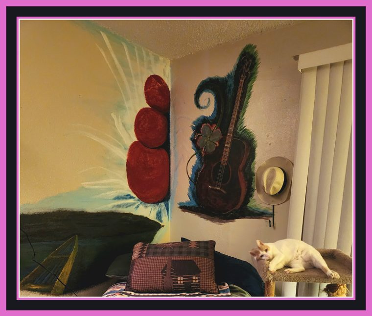 Latest state of the corner mural: the fruit now deep red against a golden ground, the burst of light brighter behind it, the boat out on dark night water at left and the guitar in blue-green foliage at right.