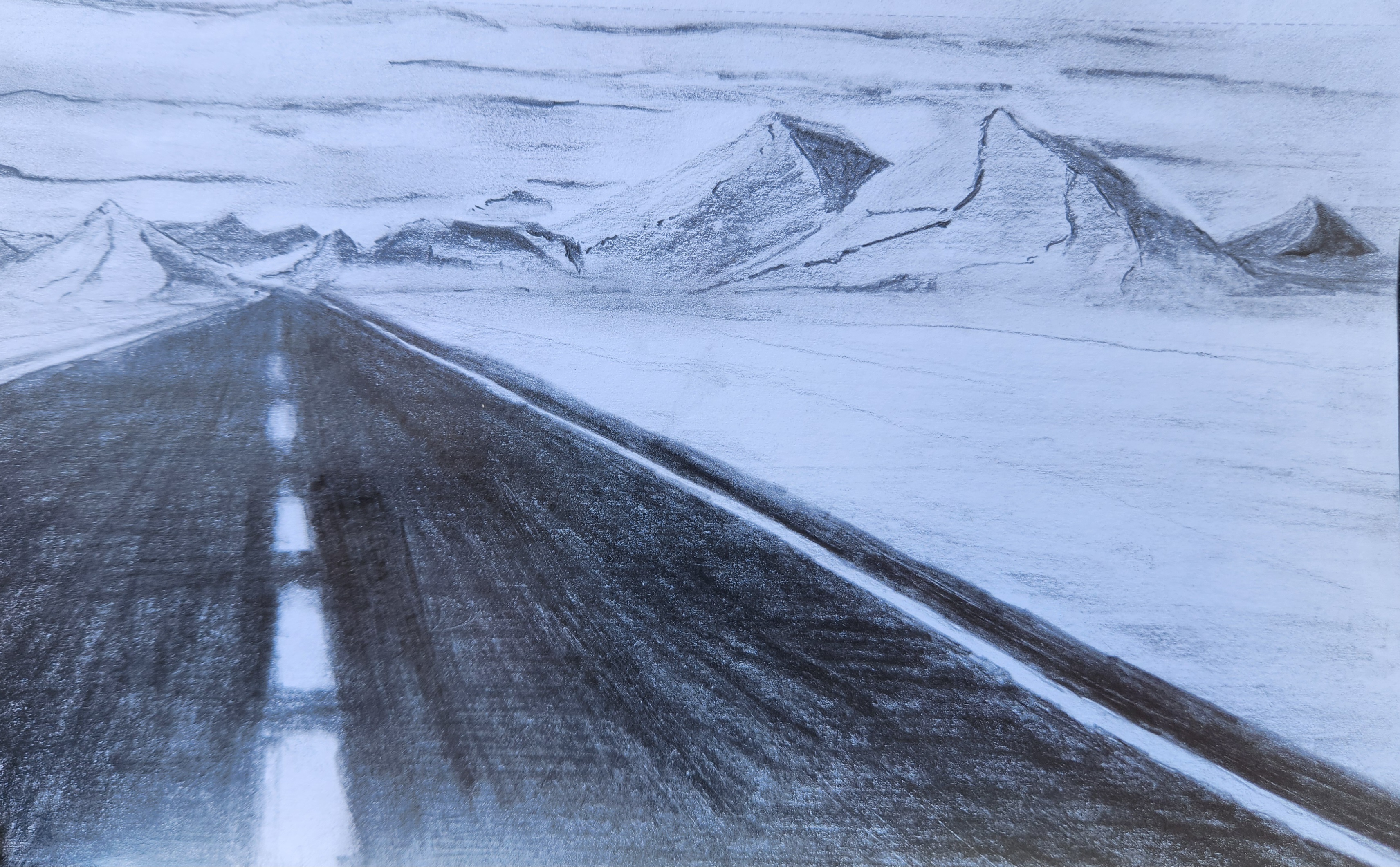 Graphite landscape of an empty road receding in one-point perspective toward a range of snow-dusted mountains beneath a clouded sky.